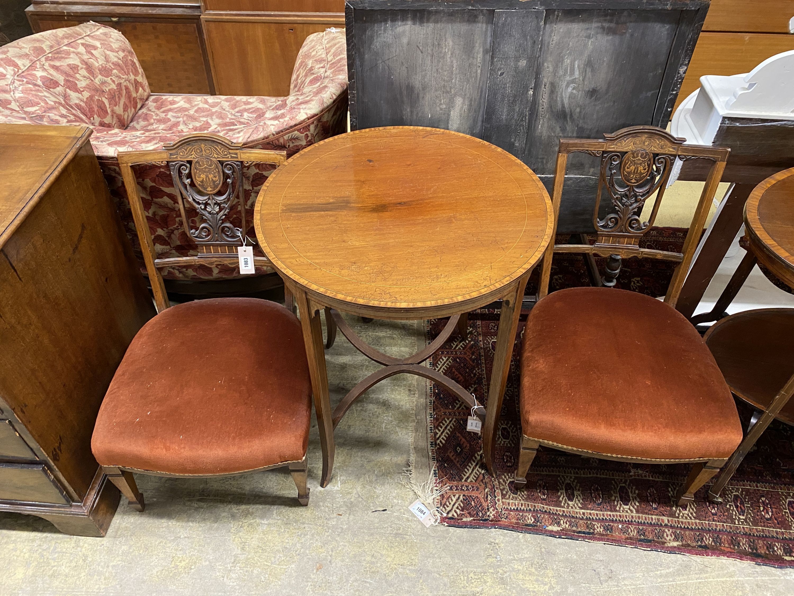 A pair of Edwardian marquetry inlaid mahogany drawing room side chairs and an Edwardian satinwood banded mahogany circular topped occasional table, diameter 60cm, height 71cm (3)
